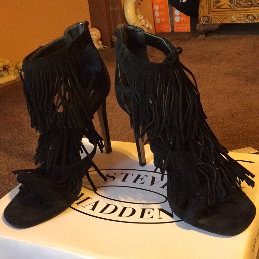 Fringly black suede heels.